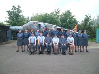 Course photo in front of 1034 ( Surbiton ) Squadrons Harrier aircraft